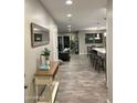 Open-concept design with tile floors, flowing into the living room and kitchen areas at 7635 E Verde Ln, Scottsdale, AZ 85251