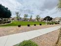 Beautiful community green space featuring expansive lawns and desert landscaping at 7734 W Terri Lee Dr, Phoenix, AZ 85035