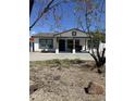 Lovely single-story home featuring a cozy covered front porch with rustic supports and drought-tolerant landscaping at 1836 W Las Palmaritas Dr, Phoenix, AZ 85021