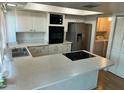 Spacious kitchen with stainless steel appliances and breakfast bar at 2051 W Elm St, Phoenix, AZ 85015