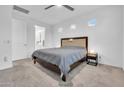 Spacious bedroom featuring neutral carpet, a ceiling fan, and ample natural light at 22560 E Rosa Rd, Queen Creek, AZ 85142