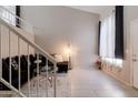 Cozy living room featuring wood-look floors, staircase and large window at 3755 E Broadway Rd # 36, Mesa, AZ 85206