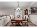 Elegant dining room featuring a spacious table and an open layout, adjacent to the living area at 3915 S 186Th Ln, Goodyear, AZ 85338