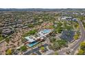 An aerial view shows the community's amenities including a modern clubhouse and swimming pool at 3932 E Melinda Dr, Phoenix, AZ 85050