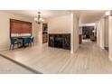 Open concept living area with dining room and wine storage, tile flooring at 4245 E Yawepe St, Phoenix, AZ 85044