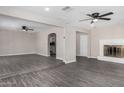 Spacious living room features wood-look floors and is open to the dining and Gathering areas at 4750 N 50Th Ave, Phoenix, AZ 85031