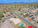 Aerial view of a residential neighborhood featuring a private pool and desert landscaping at 5049 E Duane Ln, Cave Creek, AZ 85331