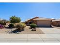 Inviting home with desert landscaping, drought-resistant plants, and a two-car garage at 5049 E Duane Ln, Cave Creek, AZ 85331