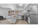 Modern kitchen featuring stainless steel appliances, granite countertops, and ample cabinet space at 5229 W Palo Verde Ave, Glendale, AZ 85302
