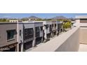 Townhome complex with individual garages and views of mountains at 7347 E Vista Bonita Dr, Scottsdale, AZ 85255