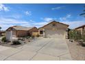 Attractive single-level residence with a xeriscaped front yard and an attached two-car garage at 10832 W Piute Ave, Peoria, AZ 85373