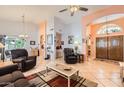 Bright living room showcasing high ceilings, tile floors, and an open floor plan at 14680 W Morning Star Trl, Surprise, AZ 85374