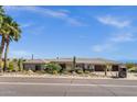 Lovely desert home featuring stone accents, well-kept landscaping, and a tile roof at 15620 E Palomino Blvd, Fountain Hills, AZ 85268
