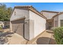 A well-maintained single-story home with a neutral color scheme and a two-car garage at 16232 W Montoya Dr, Surprise, AZ 85374