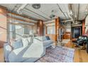 Spacious living room featuring hardwood floors, ductwork, city views, and an open floor plan at 21 E 6Th St # 311, Tempe, AZ 85281