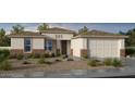 Charming exterior view of a single-story home with desert landscaping and a welcoming entrance at 25109 N 171St Ave, Surprise, AZ 85387