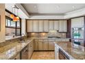 Gourmet kitchen with stainless steel appliances, granite countertops, and custom cabinetry at 25150 N Windy Walk Dr # 37, Scottsdale, AZ 85255