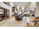 Bright living room with high ceilings, large windows and fireplace at 25150 N Windy Walk Dr # 37, Scottsdale, AZ 85255