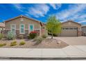 Well-maintained single-story home featuring desert landscaping, a paver driveway, and a two-car garage at 28623 N 66Th Ave, Phoenix, AZ 85083