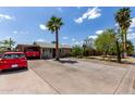 Charming single-story home with a palm tree in the front yard and covered parking at 3311 E Harvard St, Phoenix, AZ 85008