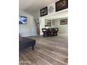 Spacious living room area perfect for relaxing and entertaining, featuring tiled floors and natural light at 4123 N 106Th N Ave, Phoenix, AZ 85037