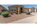 Single-story home with a red tile roof, desert landscaping, and an attached two-car garage at 5612 N 109Th Ave, Phoenix, AZ 85037