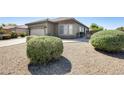 Single-story home with desert landscaping and covered entry at 6319 W Hilton Ave, Phoenix, AZ 85043