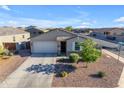 Charming single-Gathering home featuring a two-car garage, well-manicured landscaping, and a welcoming front entrance at 7145 E Eagle Nest Way, San Tan Valley, AZ 85143
