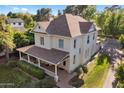 Aerial view showcases a lovely home with a covered porch and a well-maintained lawn at 7252 N Central Ave, Phoenix, AZ 85020