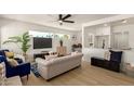 Bright living room featuring wood floors, modern furnishings, and an open floor plan at 9602 N 5Th Ave, Phoenix, AZ 85021