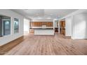 Spacious living area featuring an open floorplan with hardwood floors and recessed lighting at 9705 E Sector Dr, Mesa, AZ 85212