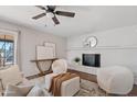 Bright living room with cozy seating and a decorative fireplace, creating a relaxing atmosphere at 1411 W Mendoza Ave, Mesa, AZ 85202