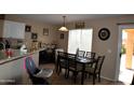 Cozy dining area with large windows, perfect for Gathering meals at 1417 E Rosebud Dr, San Tan Valley, AZ 85143