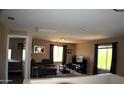 Comfortable living area with large windows, offering plenty of natural light at 1417 E Rosebud Dr, San Tan Valley, AZ 85143