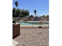 Community pool with barbecue for residents at 1750 E Mateo Cir # 106, Mesa, AZ 85204