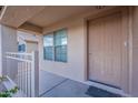 Inviting front porch with a view of the well-maintained landscape at 30944 N Bramwell Ave, San Tan Valley, AZ 85143