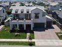 Beautiful home with a large balcony, well-manicured lawn, and a wide driveway at 3669 E Boot Track Trl, Gilbert, AZ 85296