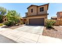 Beautiful two-story home with a concrete driveway and well manicured landscaping at 4061 E Torrey Pines Ln, Chandler, AZ 85249