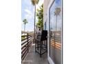 Cozy balcony with outdoor seating, offering a relaxing view of the surrounding neighborhood at 4343 N 21St St # 213, Phoenix, AZ 85016