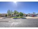A cozy single-Gathering home with mature landscaping and a sunny, clear blue sky above at 5038 N 20Th Ave, Phoenix, AZ 85015