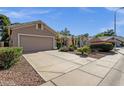 Street view of a single-story home with desert landscaping and a large driveway at 5353 W Dublin Ct, Chandler, AZ 85226
