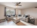 Comfortable living room with neutral tones, a ceiling fan, and abundant natural light at 5607 N 23Rd Ave, Phoenix, AZ 85015