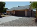 Charming single-story home featuring a well-maintained front yard and a two-car garage at 6546 N 71St Ave, Glendale, AZ 85303