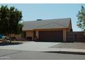 Charming single-story home featuring a well-maintained front yard and a two-car garage at 6546 N 71St Ave, Glendale, AZ 85303
