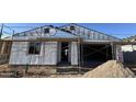 Exterior view of a home under construction, showcasing the framing and initial stages of development at 7604 W Saddlehorn Rd, Peoria, AZ 85383