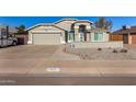 Charming single-Gathering home with a well-maintained front yard and attached two car garage at 7810 W Beryl Ave, Peoria, AZ 85345