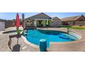 A stunning backyard pool with spa, patio and seating, perfect for relaxation and entertainment at 7810 W Beryl Ave, Peoria, AZ 85345