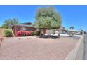 Beautiful single-story home with manicured landscaping and charming curb appeal in a desirable location at 1220 E Avenida Ellena St, Casa Grande, AZ 85122