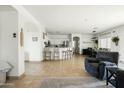 Open-concept living space with dining area and breakfast bar offers ample space for Gathering gatherings at 12209 W Washington St, Avondale, AZ 85323