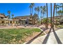 Expansive outdoor area with green space and palm trees, ideal for leisure and recreational activities at 1331 W Baseline Rd # 120, Mesa, AZ 85202